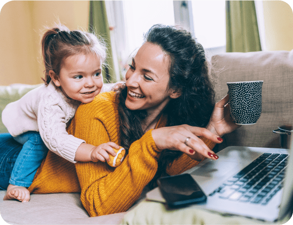 Mother and daughter sharing laptop experience